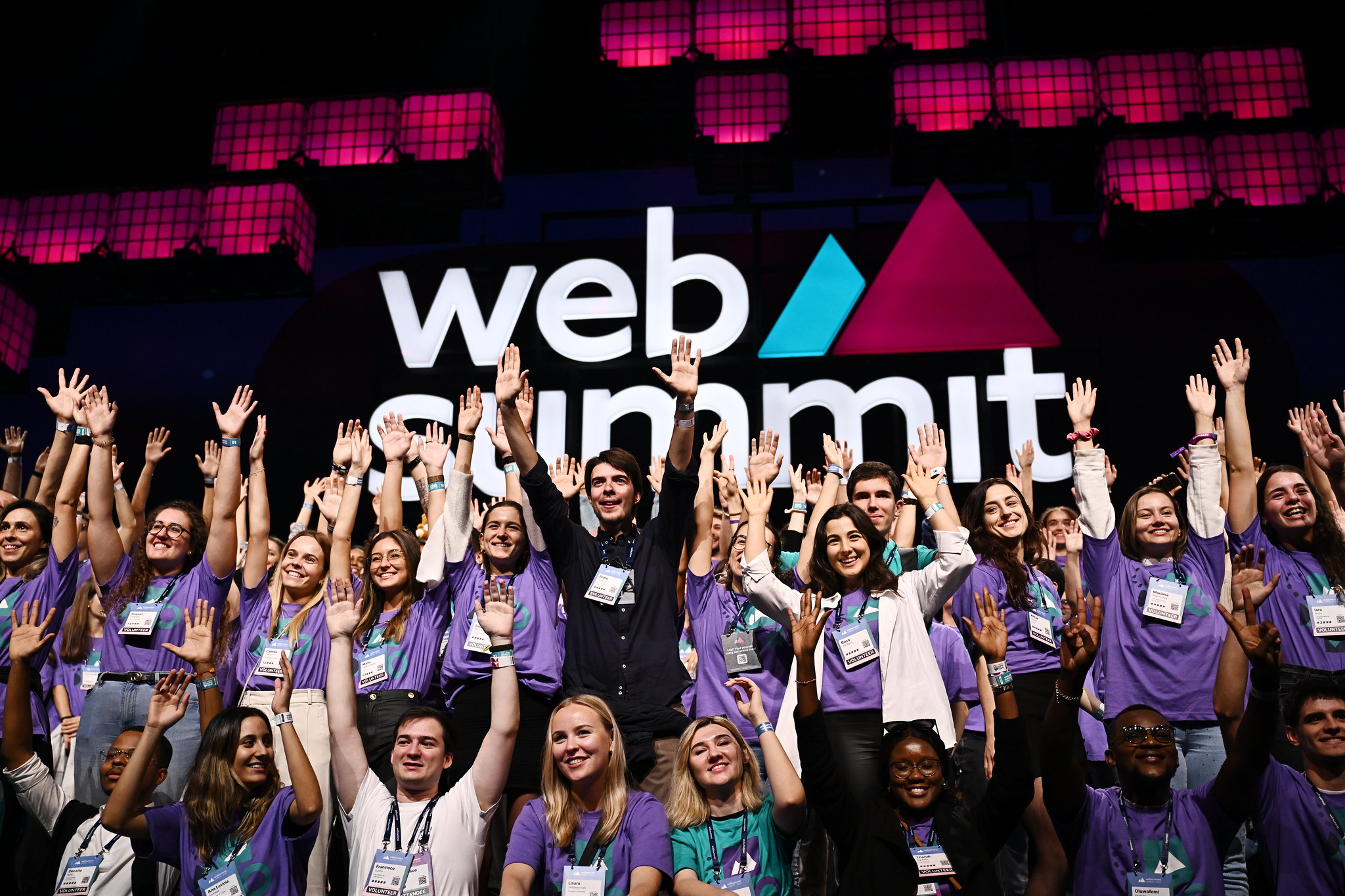 Web Summit volunteers celebrating on Centre Stage